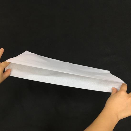 Nonwoven airplane table tray cover